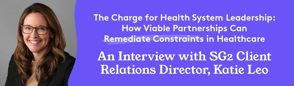 Katie Leo, SG2 Client Relations Director, smiling in glasses against gray background